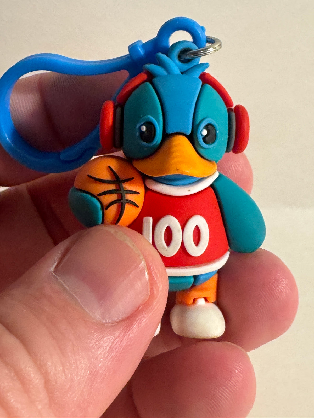 558 - Basketball Duck 100 Keychain Rubber Figure Blue Red Cute Clip On Backpack Charm