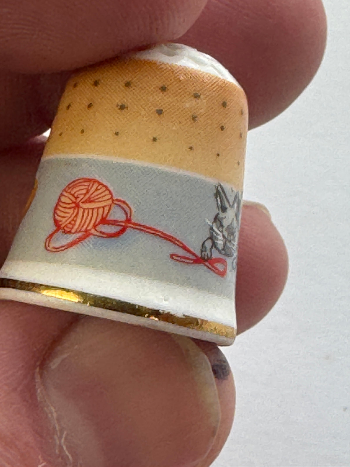517 - West Germany Vintage - Porcelain THIMBLE -  Cat playing with yarn - Gold Trim