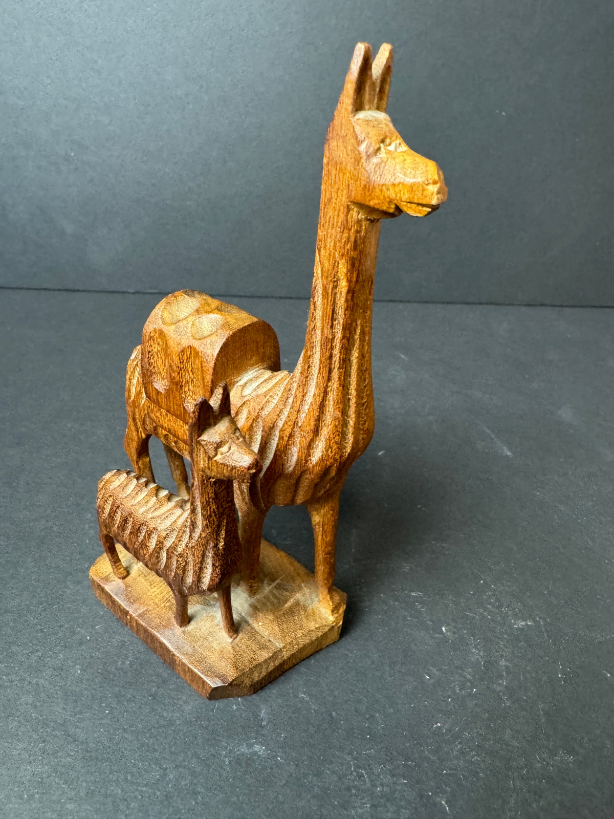 476 - Hand-Carved Wooden Figurine featuring mother Llama and baby Llama folk art