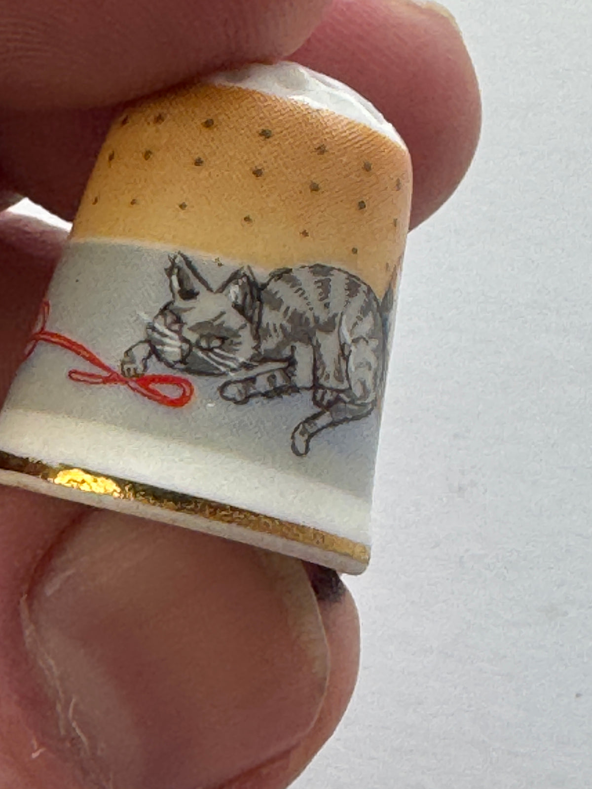 517 - West Germany Vintage - Porcelain THIMBLE -  Cat playing with yarn - Gold Trim