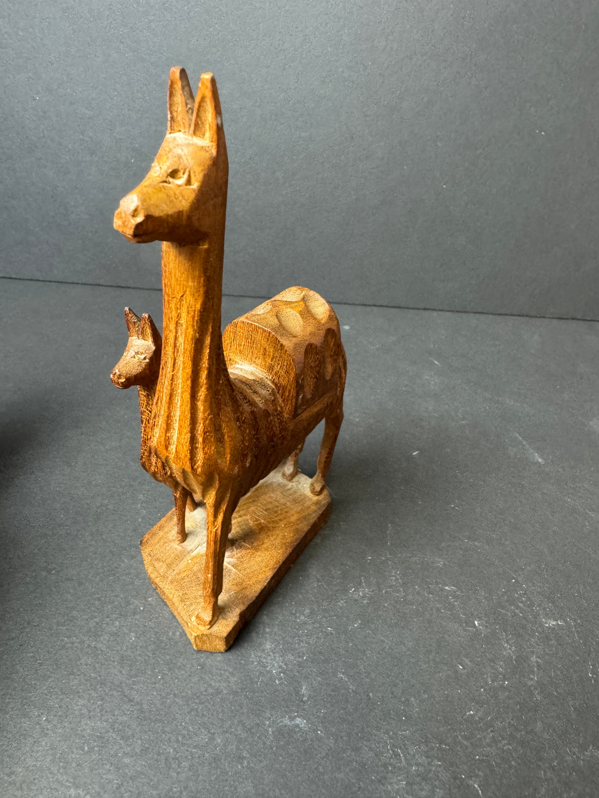 476 - Hand-Carved Wooden Figurine featuring mother Llama and baby Llama folk art