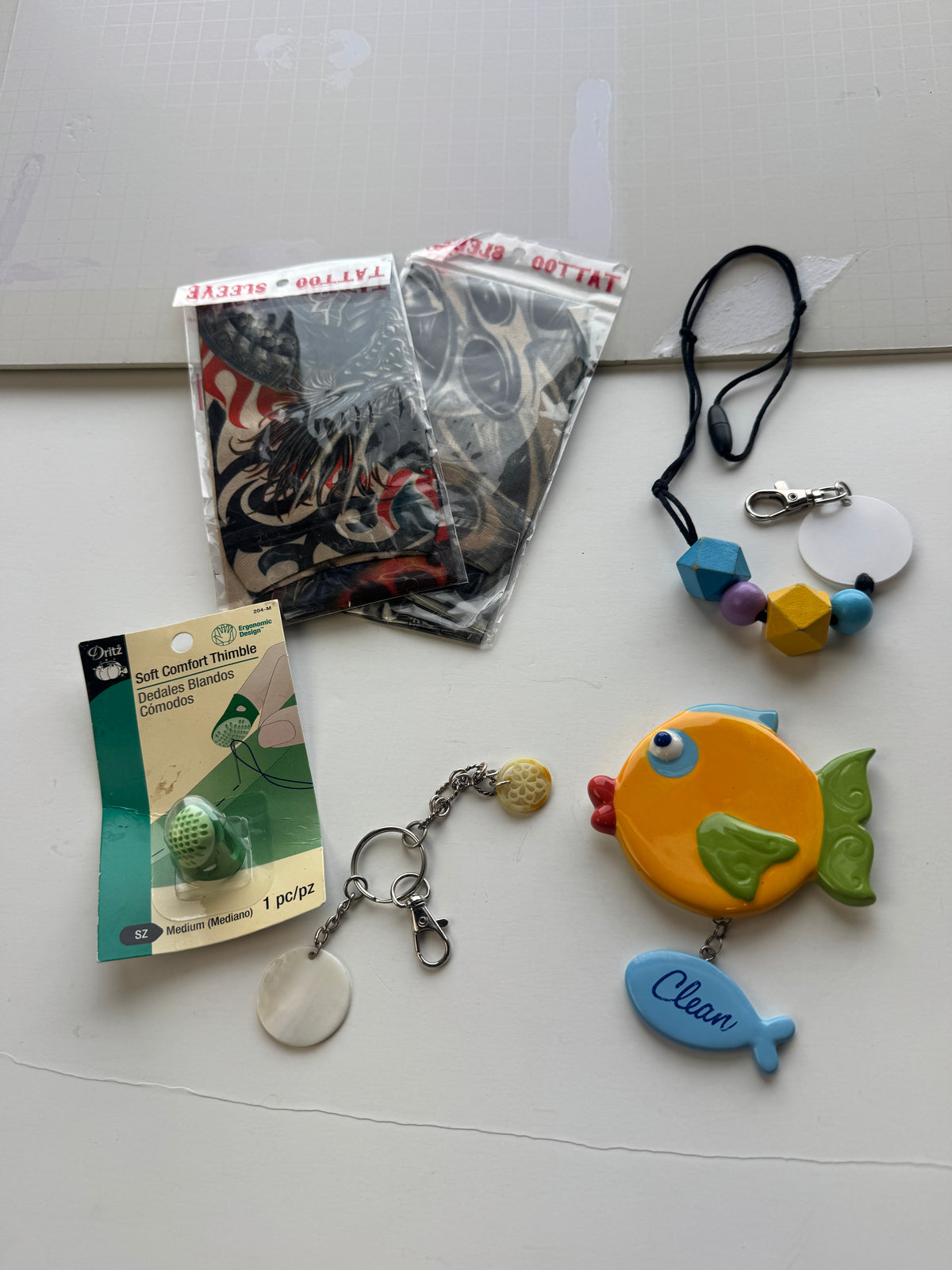 525 - bundle deal, fabric sleeve, tattoos, soft, comfort symbol, keychains, and a clean/dirty magnet fish
