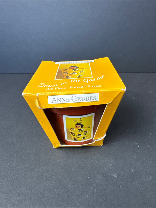 412 - Ceaco 100p puzzle - Down in the Garden, potted puzzle; Anne Geddes, 1998