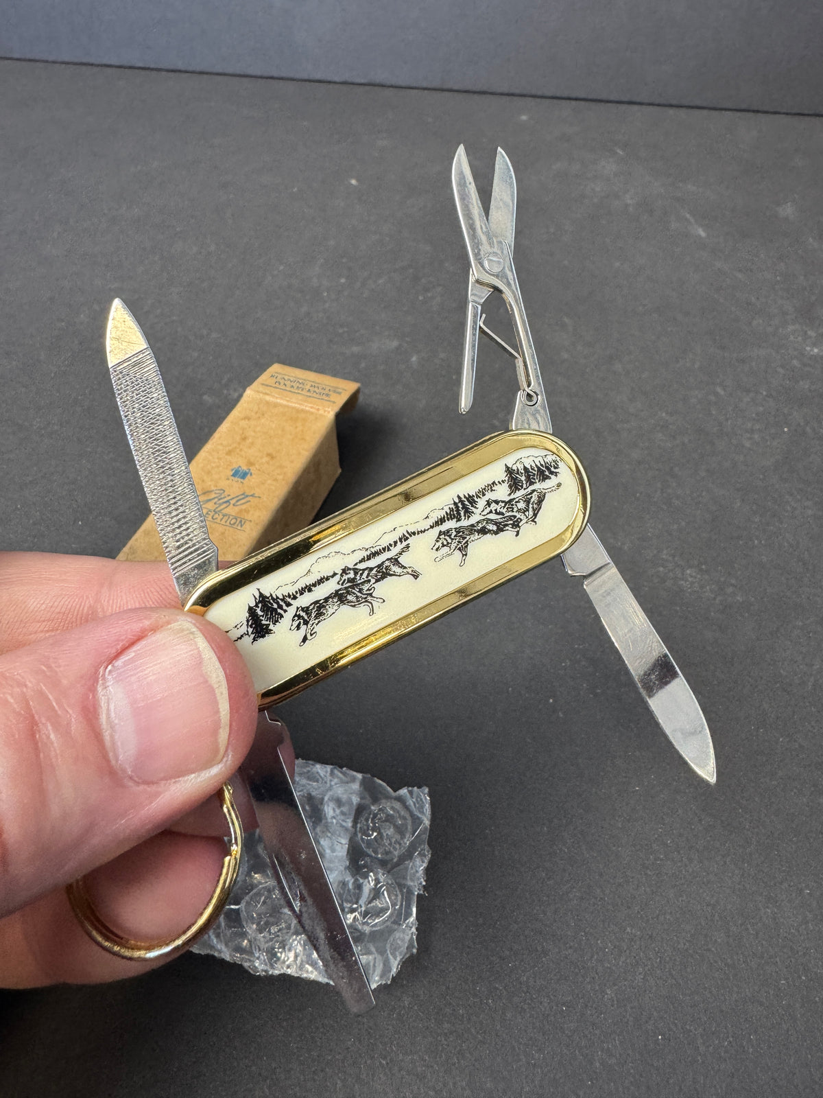 144 - Avon Collectable Running Wolves Pocket Knife Keychain Multi-Function Knife NEW