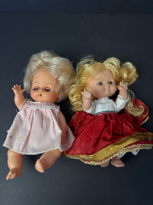 404 - vintage plastic baby dolls that much information on them