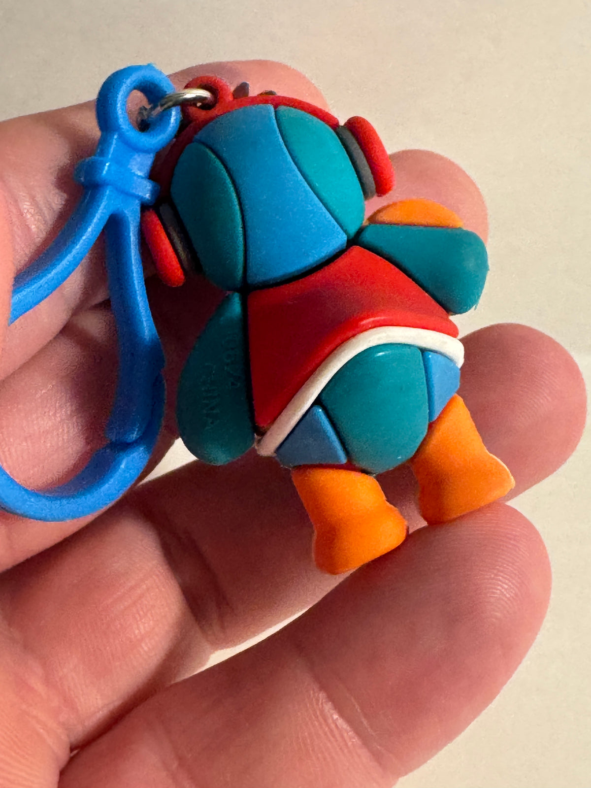 558 - Basketball Duck 100 Keychain Rubber Figure Blue Red Cute Clip On Backpack Charm