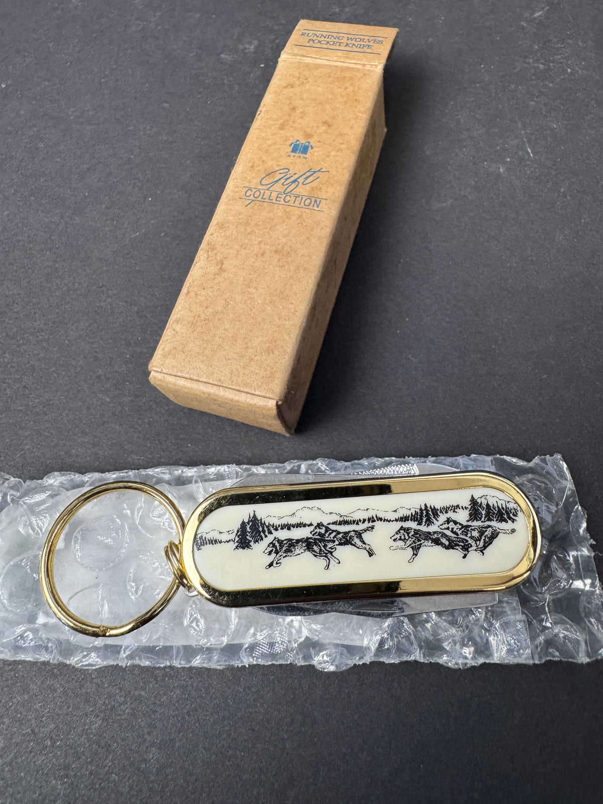 144 - Avon Collectable Running Wolves Pocket Knife Keychain Multi-Function Knife NEW